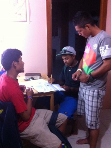 Eli with several other students discussing physics in Staff Apartment .